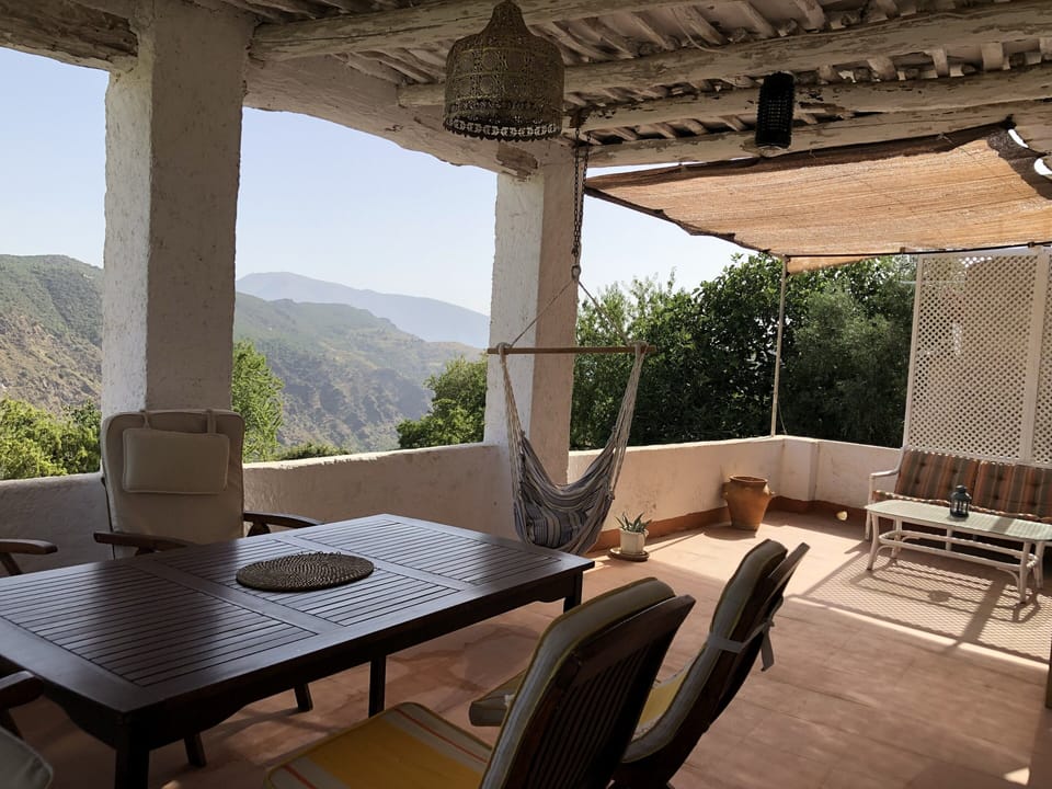 Terrace , sofa area at the end, dining area at the front of photo.