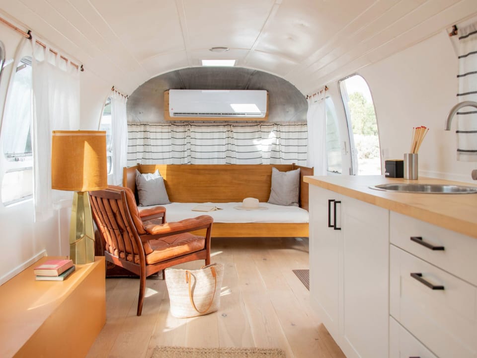 Modernized Vintage Airstream with Upscale Resort Amenities | Premium bedding, down comforters, individually decorated