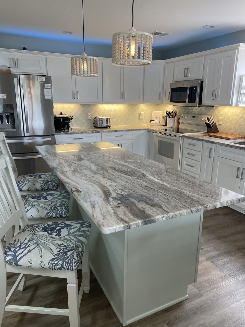 A large kitchen island makes meal prep and serving a breeze.