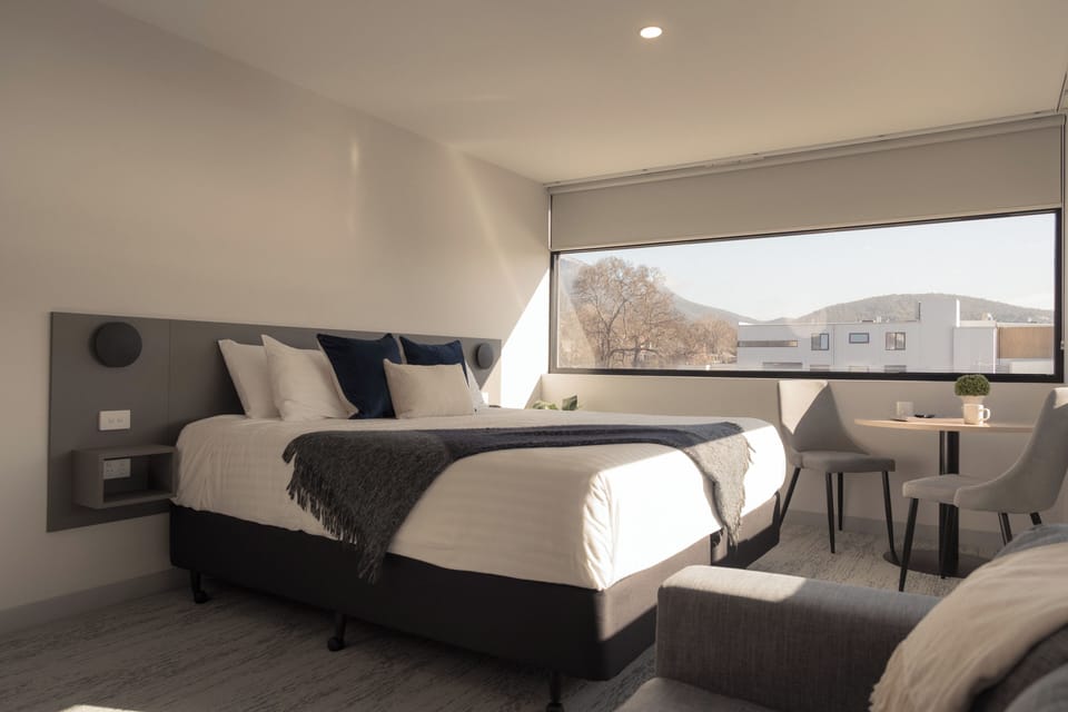 Deluxe Waterview King | Premium bedding, laptop workspace, iron/ironing board, free WiFi