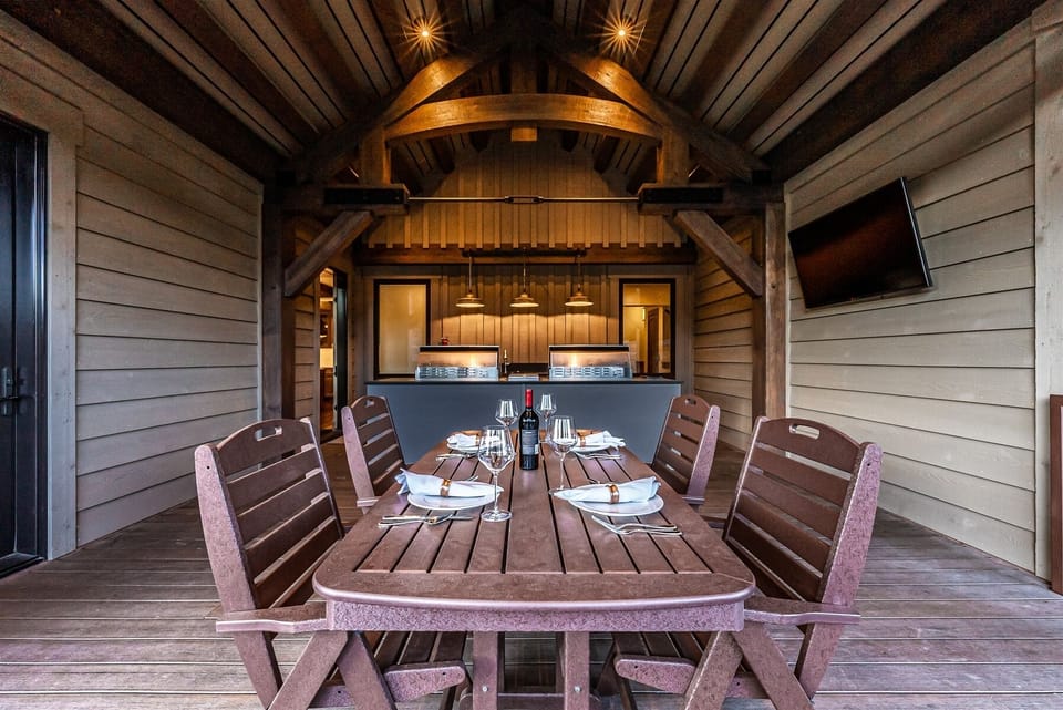 Outdoor kitchen with 2 grills and flat screen TV