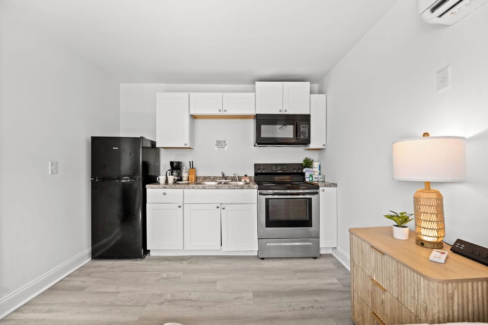 Comfort Room, 2 Queen Beds, Kitchen | Private kitchen | Fridge, stovetop, dishwasher, coffee/tea maker