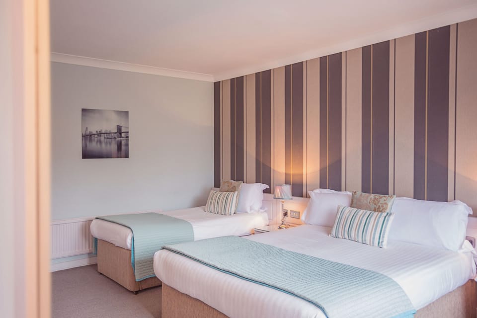 Twin Room | In-room safe, individually decorated, desk, iron/ironing board