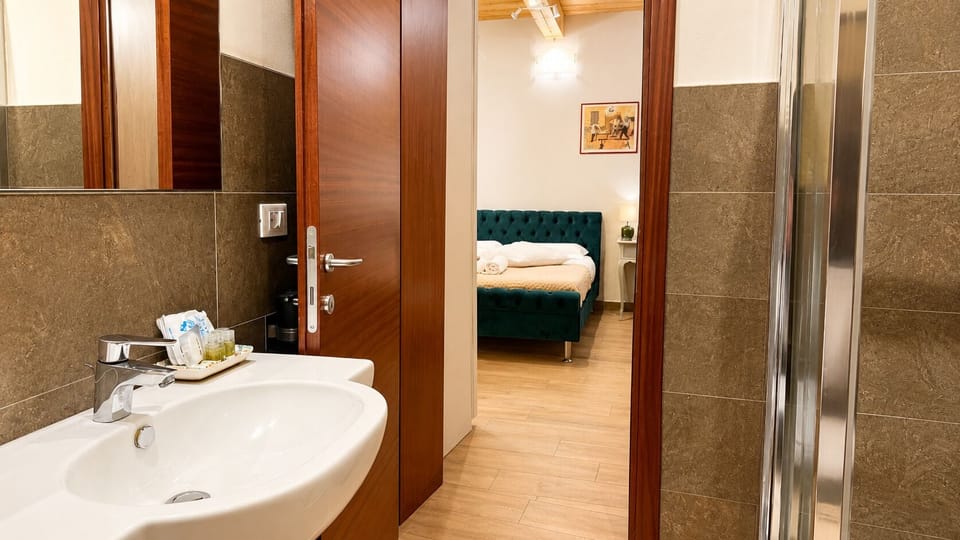 Deluxe Triple Room, 1 Bedroom | 1 bedroom, premium bedding, minibar, individually furnished