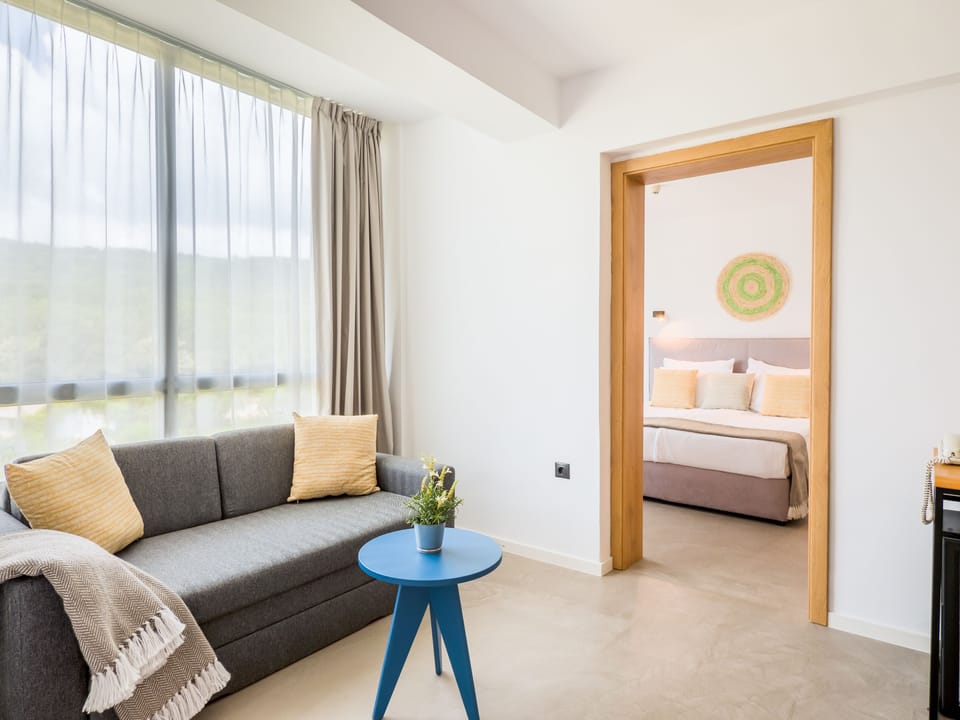 Family Suite, Balcony | Desk, bed sheets