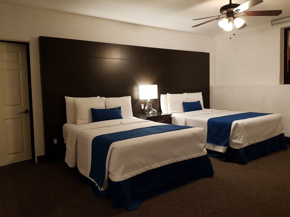 Premium Suite, Multiple Beds | Premium bedding, in-room safe, desk, blackout drapes