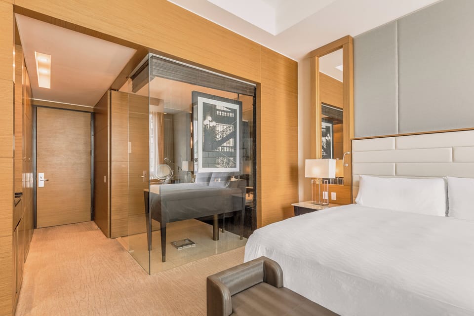 Premium bedding, down comforters, pillowtop beds, minibar