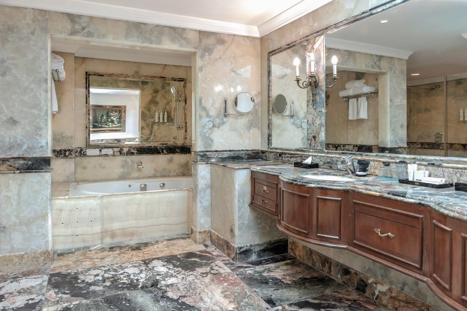 Presidential Suite 01 King Bed | Bathroom | Rainfall showerhead, designer toiletries, hair dryer, bathrobes