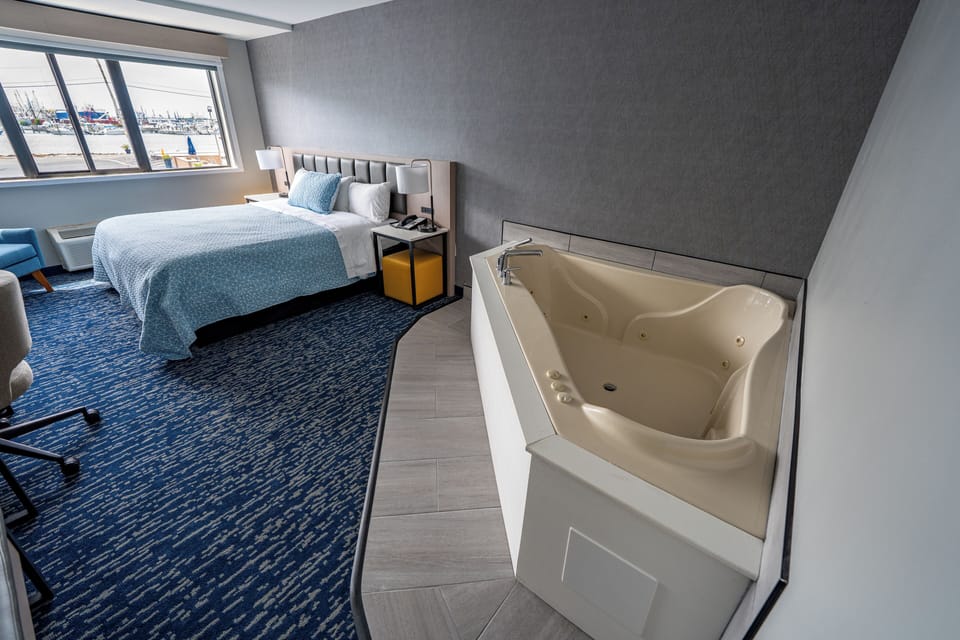 Premium Room, 1 King Bed, Hot Tub, Harbor View | Pillowtop beds, desk, iron/ironing board, bed sheets