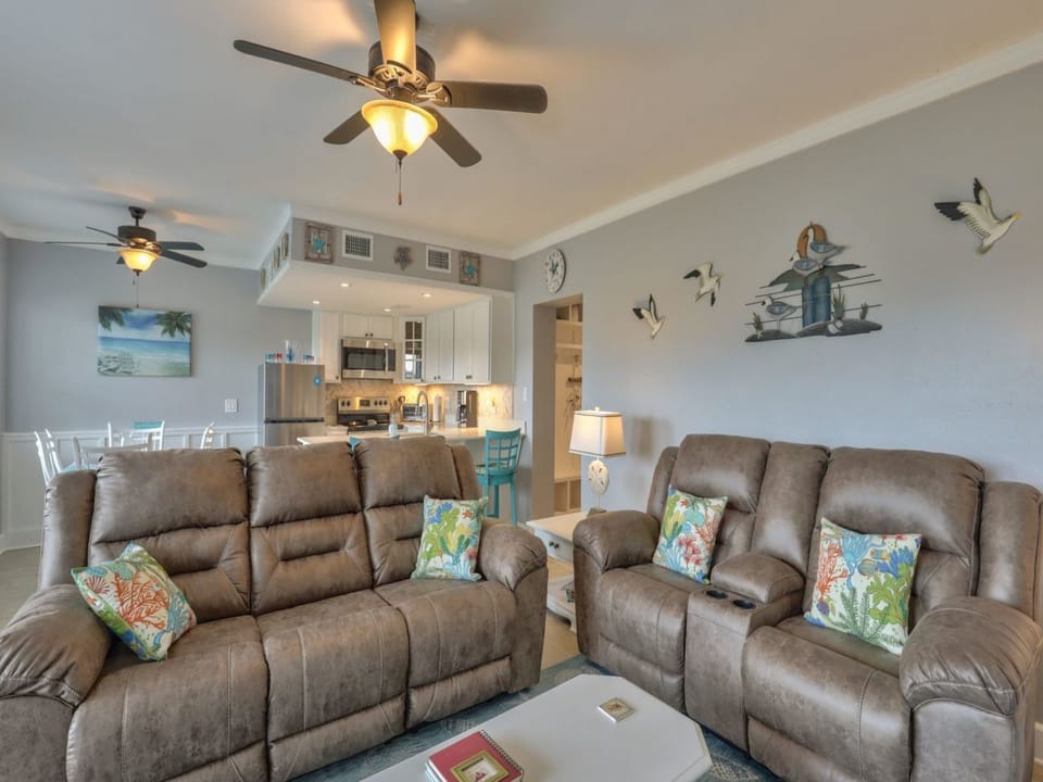 Living room with new leather reclining sofa and loveseat 