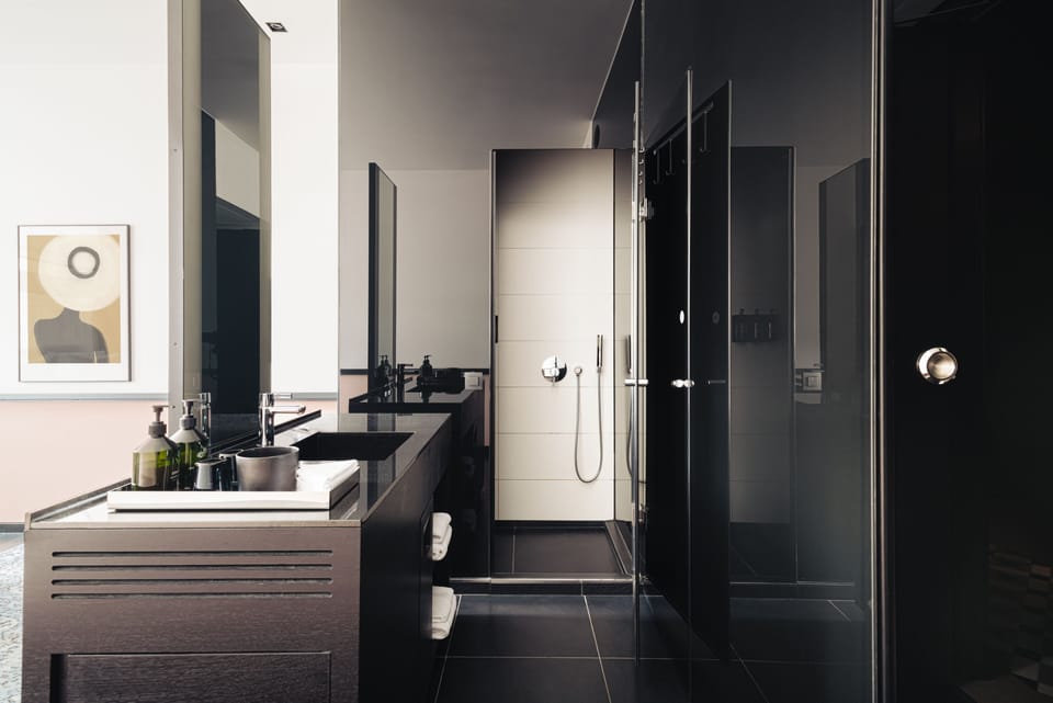 Designer toiletries, hair dryer, bathrobes, towels