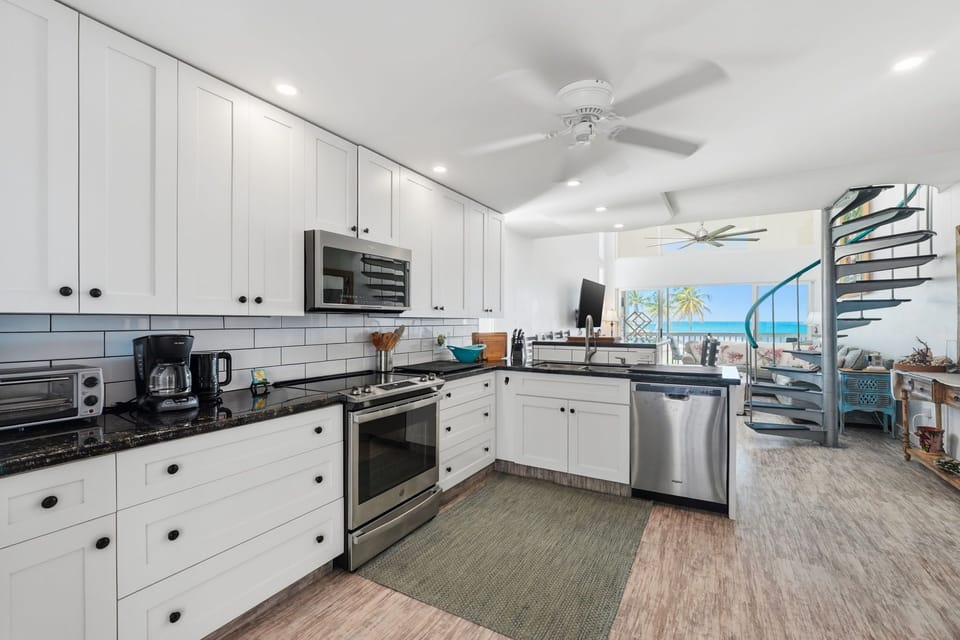 Kitchen with dishwasher, range. 