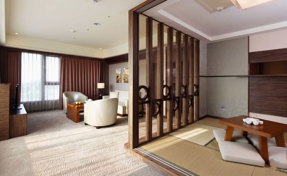 Deluxe Suite | Living area | LCD TV