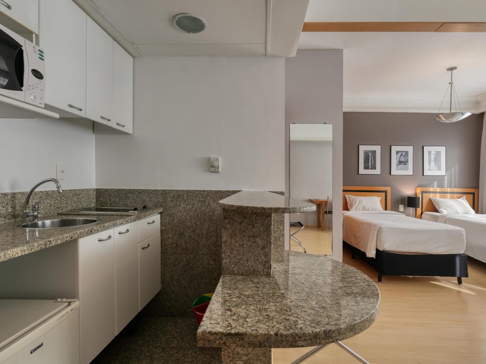 Standard Apartment, Multiple Beds | Minibar, in-room safe, desk, blackout drapes