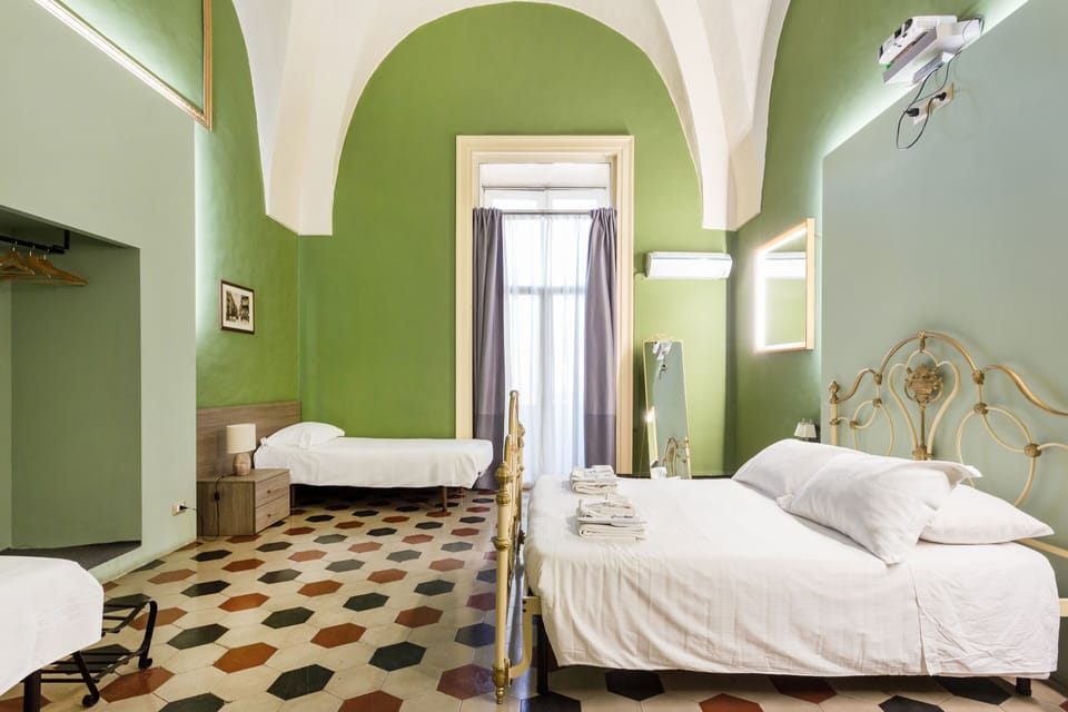 Deluxe Quadruple Room, Balcony, City View | Egyptian cotton sheets, premium bedding, memory foam beds, minibar