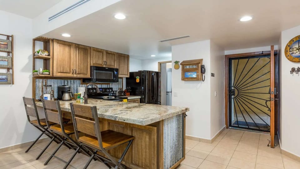 Spacious kitchen with bar seating makes meals and hangouts simple and easy