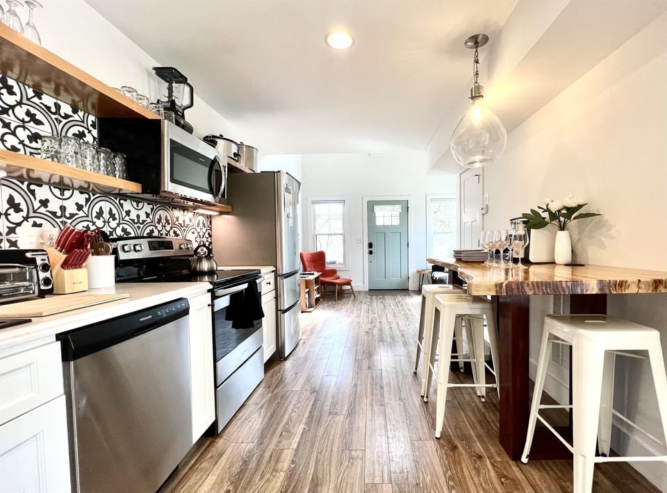 Open floor plan with Farmhouse American-minimalist design