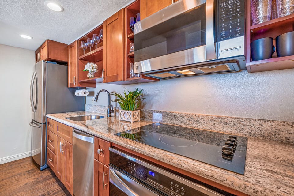 Fully stocked kitchen with stainless steel appliances