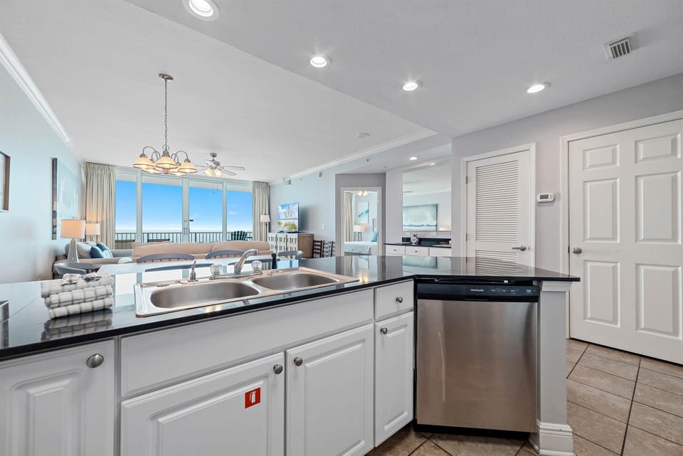 Kitchen with bar looks out onto gulf