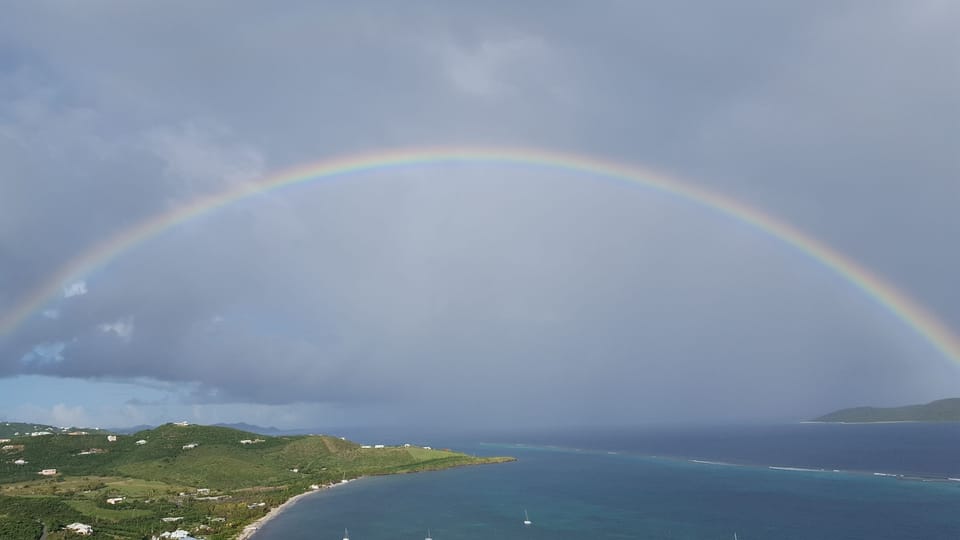 West view of huge rainbow after rain