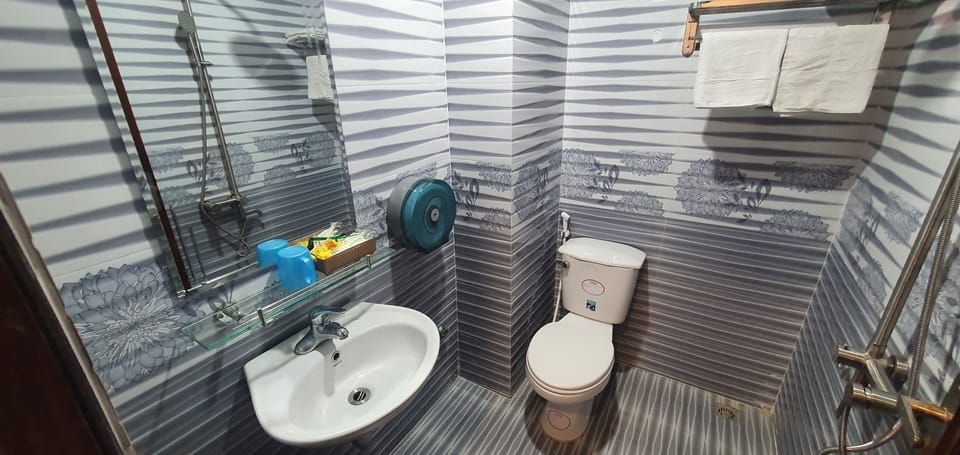 Standard Double Room | Bathroom | Shower, free toiletries, slippers, towels