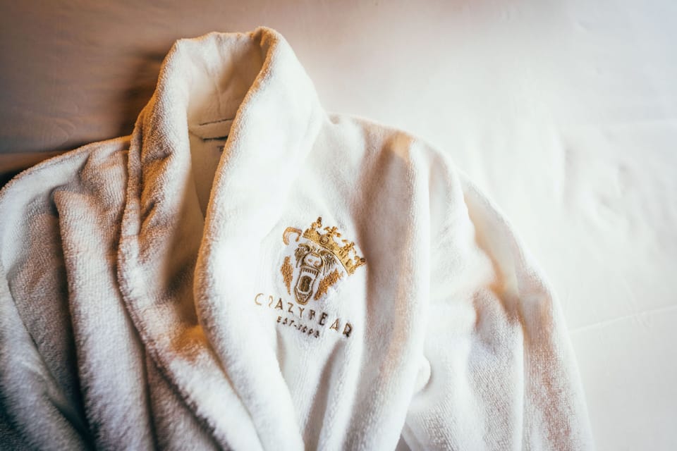 Shower, designer toiletries, hair dryer, bathrobes
