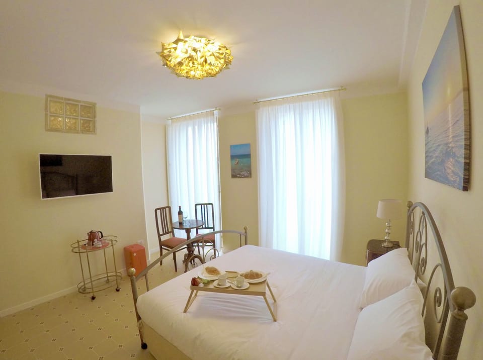 Deluxe Double Room, Balcony, City View | Minibar, in-room safe, individually decorated, individually furnished