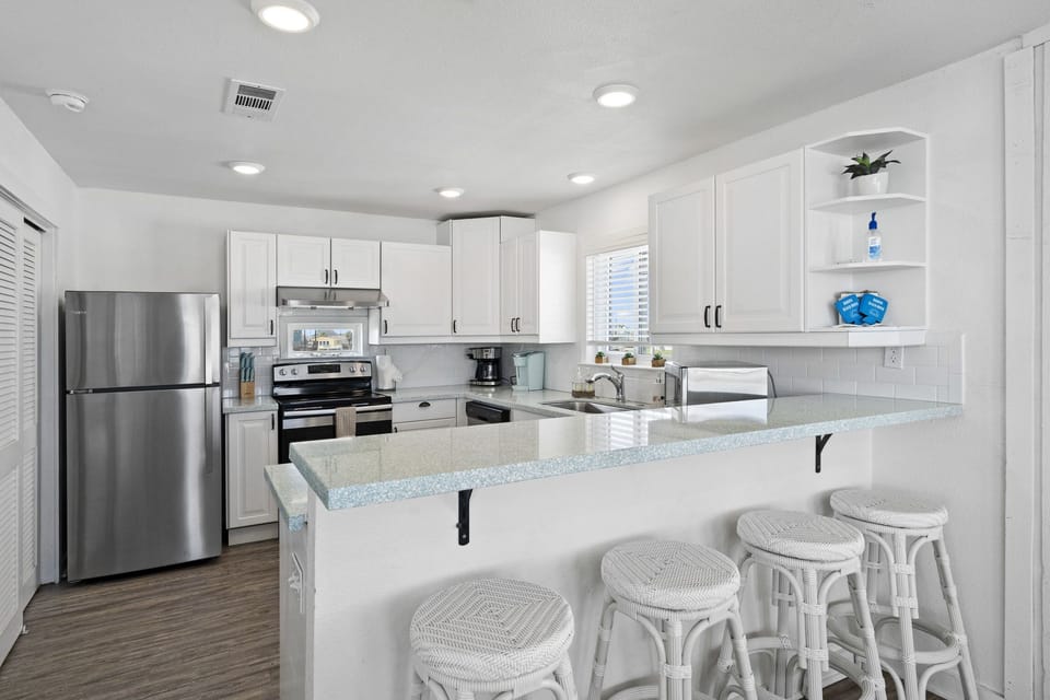 Large kitchen outfitted with high-end stainless steel appliances