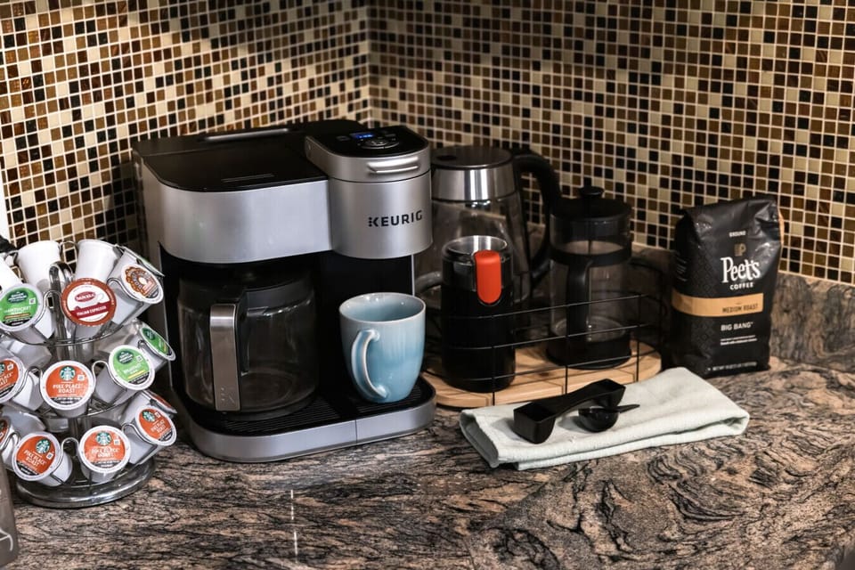 Start your mornings right at the full coffee station—everything you need for that perfect cup, enjoyed with woodland views and the peaceful sounds of nature