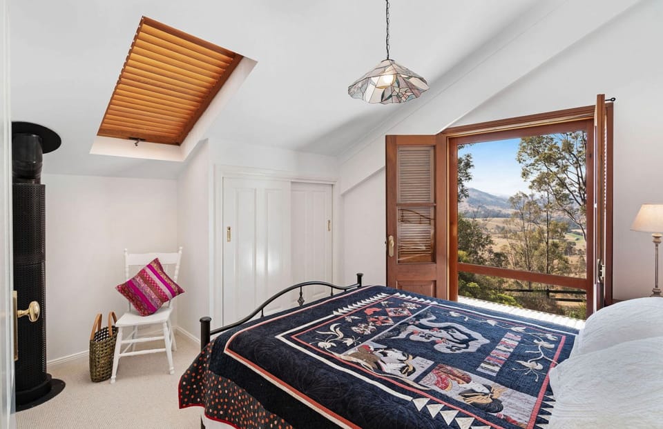 Upstairs room with Queen bed & views