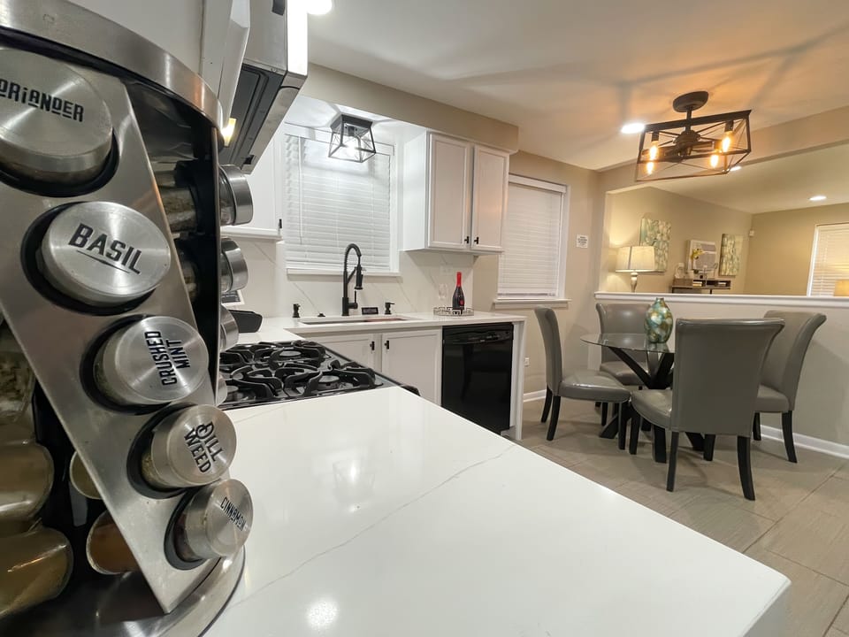 WOW! Amazing fully stocked kitchen with quartz countertop, full backsplash, etc.