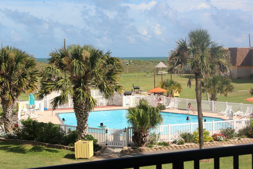 Watch the kiddos at the pool from your private balcony