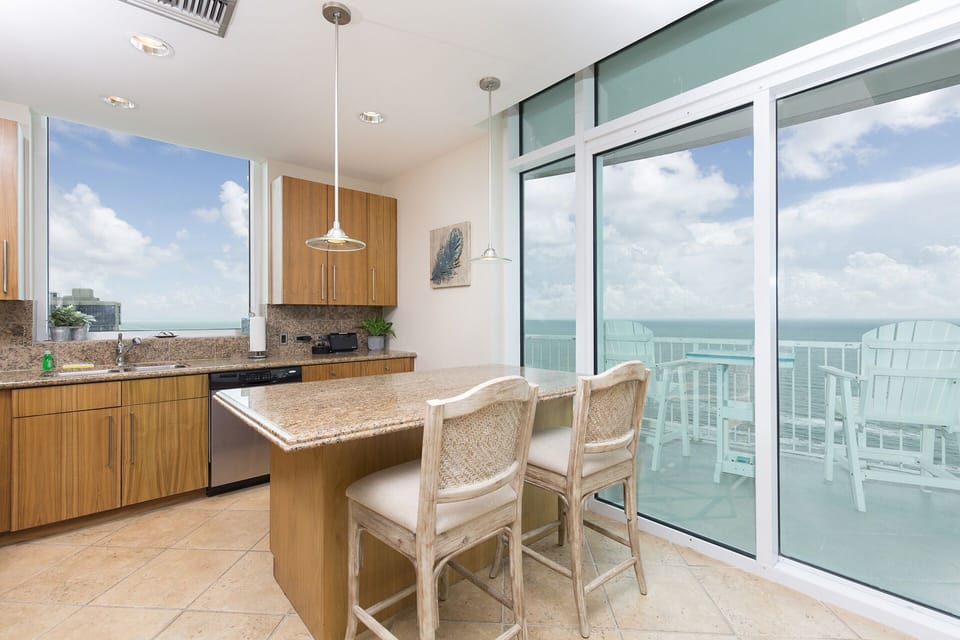 Modern kitchen with access to the private balcony.