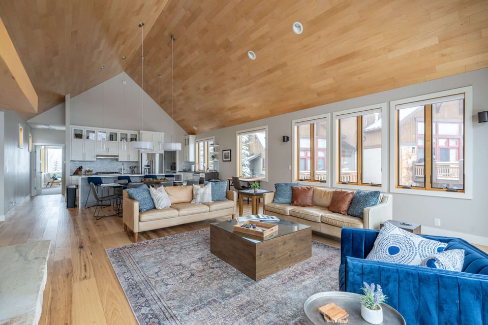 Open concept main living area leads into the dining area and kitchen