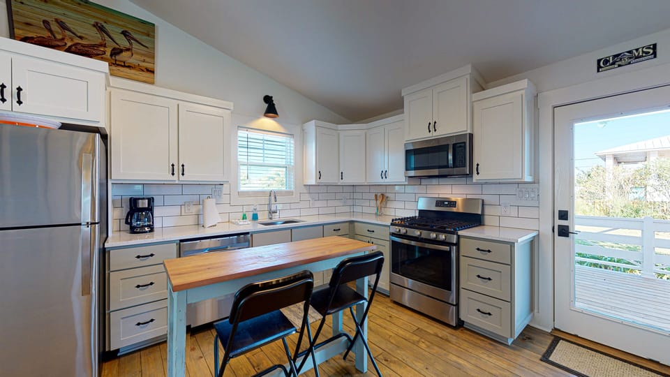 Nice bright, open kitchen thoughtfully stocked.