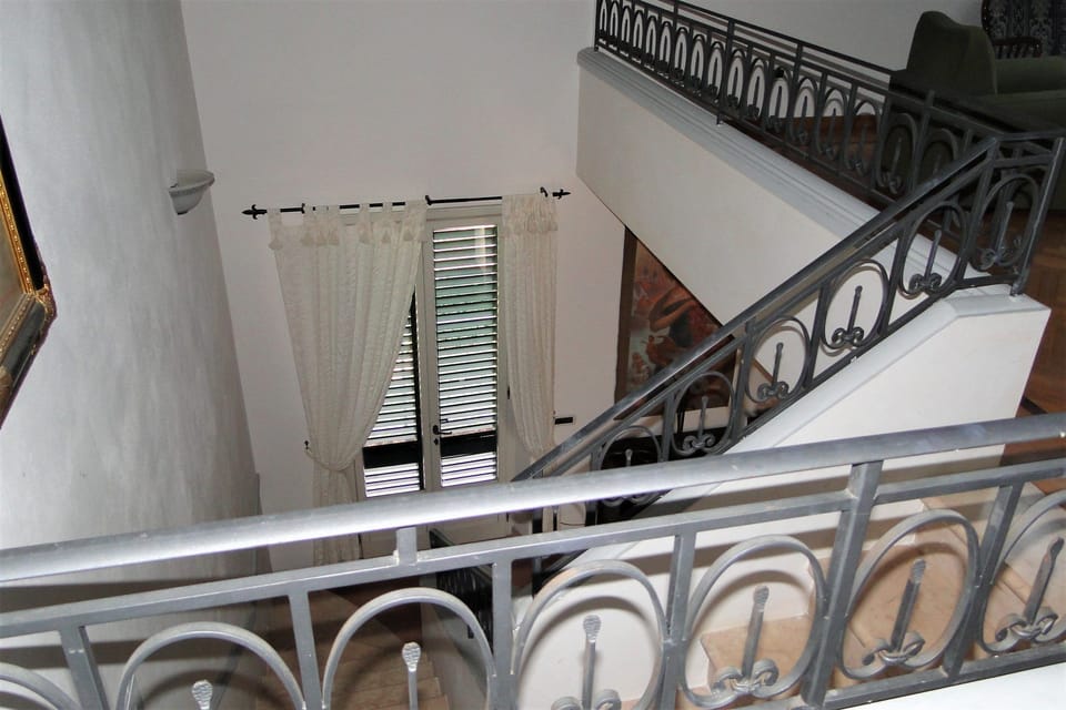 Upper floor apartment staircase leading to top floor