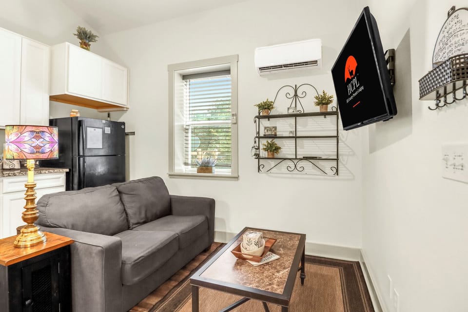 The living area has a TV and cozy seating