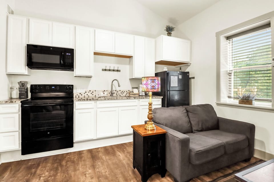 The kitchen is behind the living room