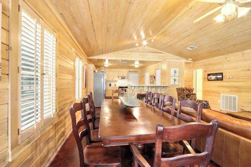 The kitchen is behind the dining room