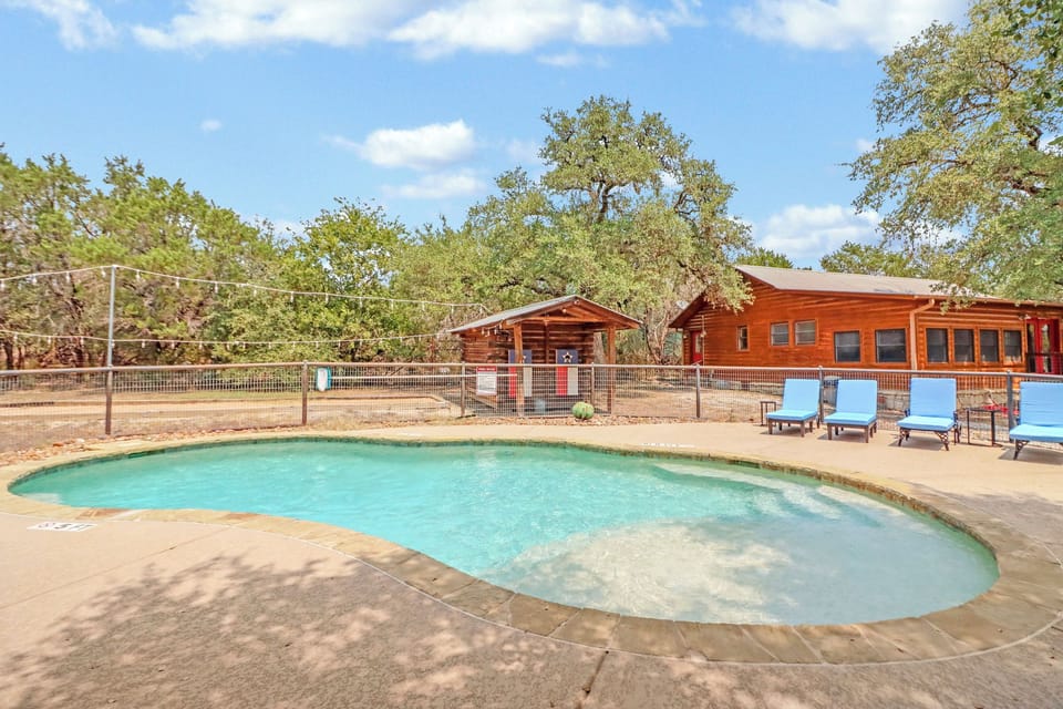 Large resort swimming pool with loungers