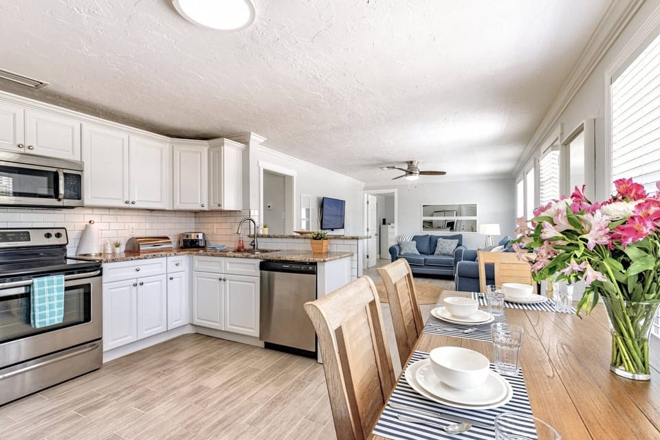Open kitchen with dining table that seats 4 comfortably.  All basic appliances and kitchen gadgets included.