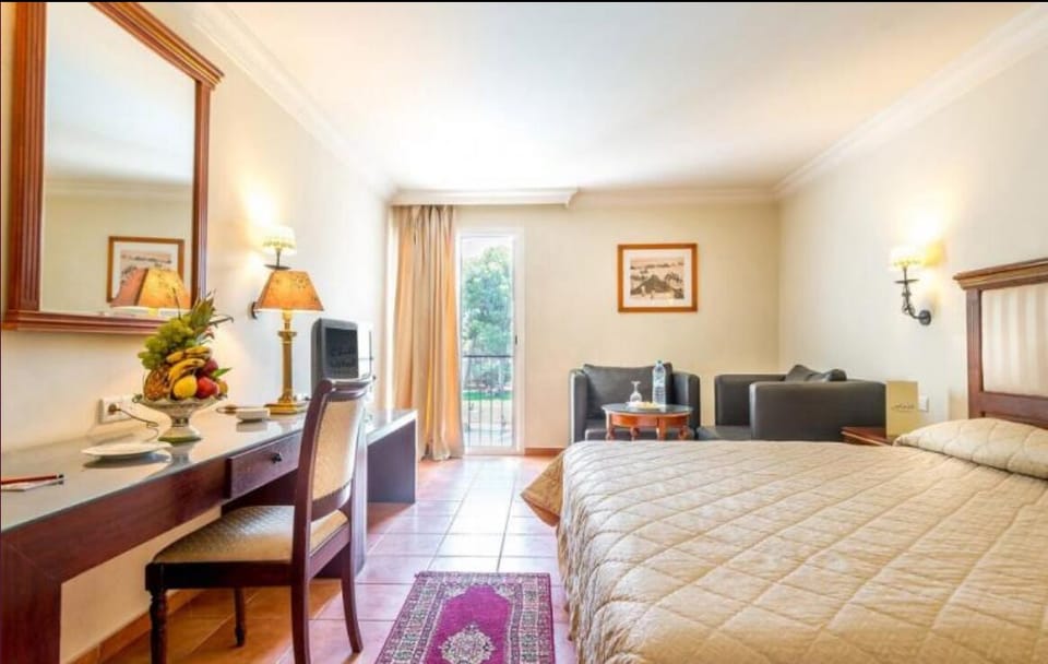 Standard Double Room | Minibar, in-room safe, desk, blackout drapes