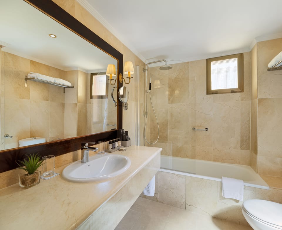 Eco-friendly toiletries, hair dryer, bathrobes, slippers