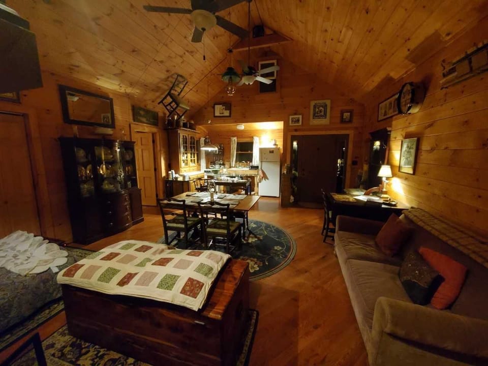 Great Room Reverse Angle looking to open kitchen and china hutches.