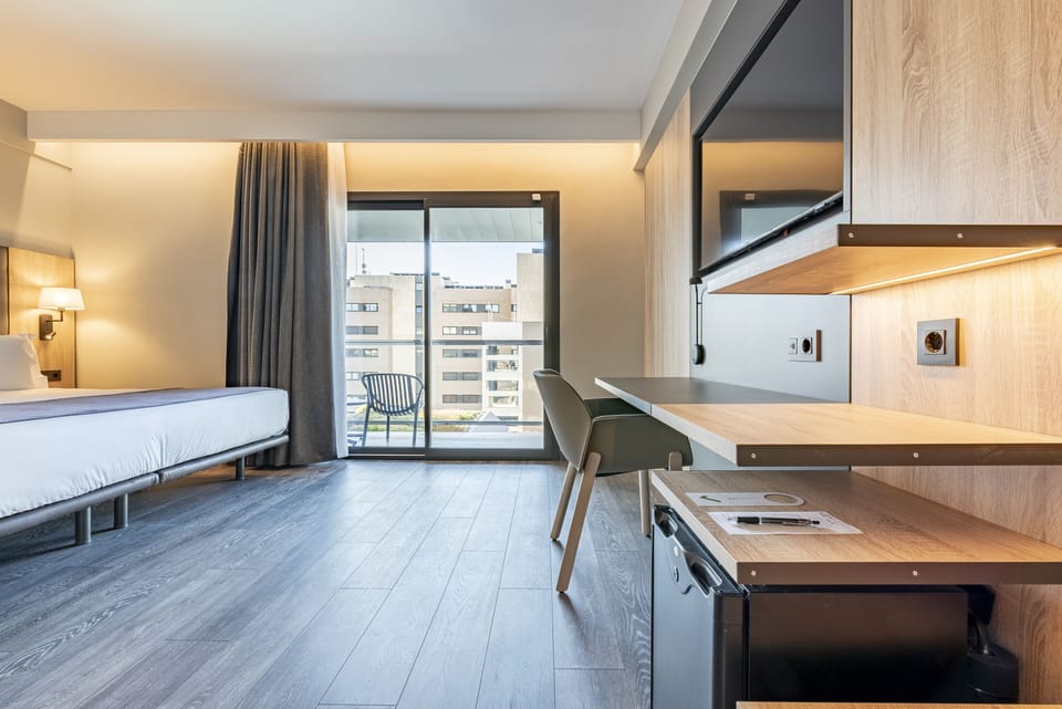 Double Room, Pool View | Down comforters, minibar, desk, blackout drapes