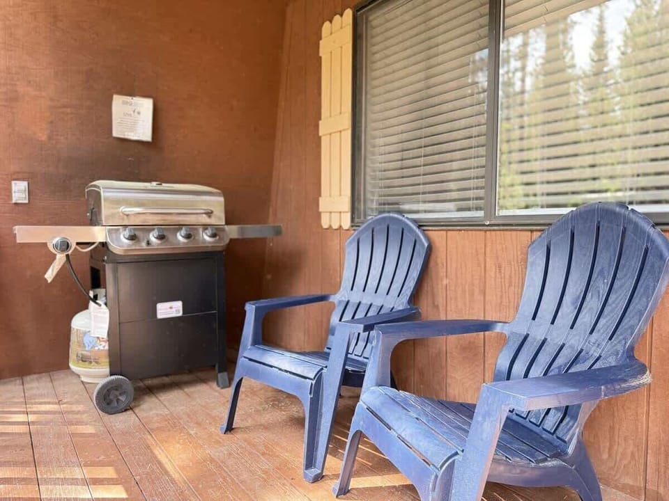 chairs and grill on the front deck.