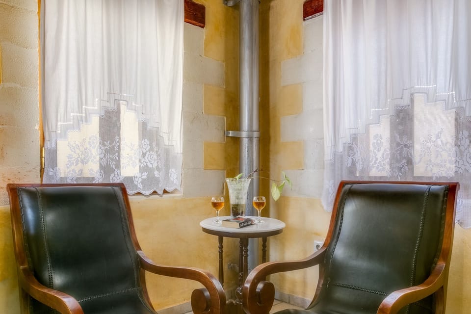 Luxury Double Room, City View | Living room | TV