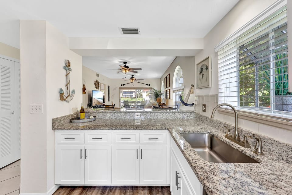 Open floorplan allows you to see the beautiful canal waters from the kitchen.