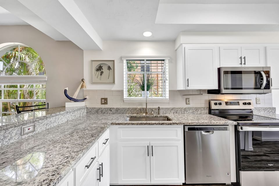 Modern, full-size kitchen has everything you need to cook meals. Service for 8.