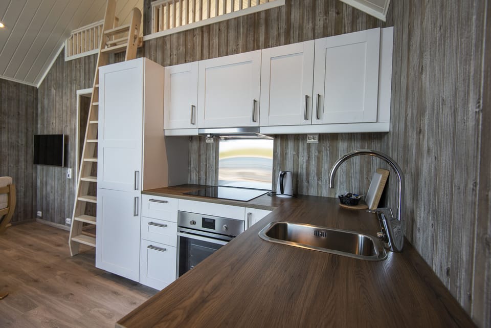 Seaview Rorbu Vega | Private kitchen | Full-size fridge, oven, dishwasher, electric kettle